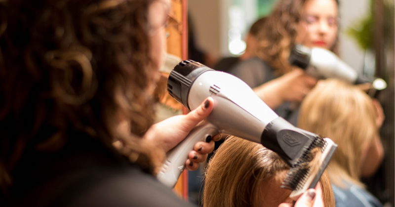 Reds Hair Salon Stylist Blowaving Hair